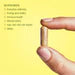 BePure One - yellow multivitamin capsule held in hand with ingredient list visible