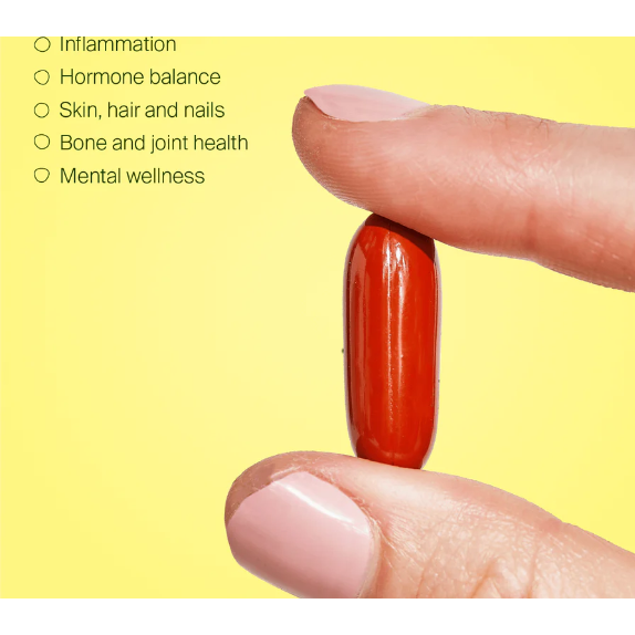 BePure Three Fish Oil - red softgel capsule held between fingers with health benefits list