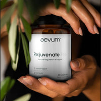 AEVUM Rejuvenate Pro supplement bottle displayed in a pair of female hands, promoting immune support, gut health, and cellular repair