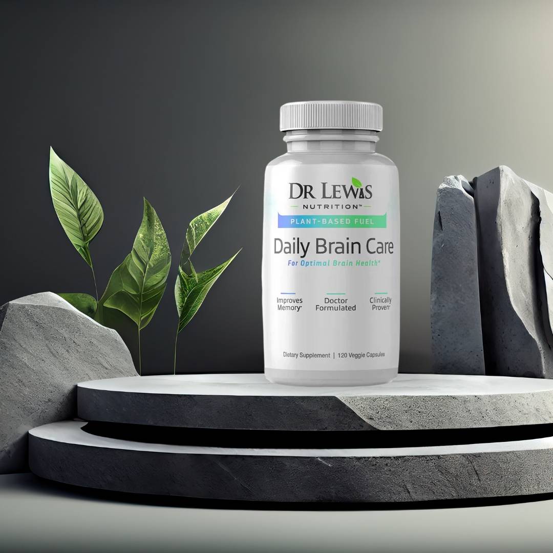 Lifestyle image of Dr. Lewis Daily Brain Care supplement on stone pedestal with greenery, highlighting memory, clarity, and cognitive support.